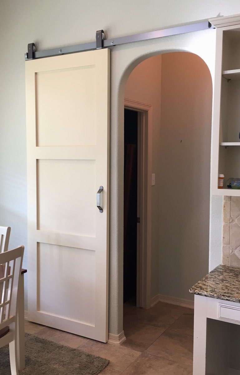 Shaker style barn door in Sacramento kitchen.